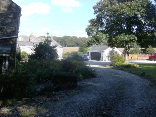 a road in a residential neighborhood with a house at Trehellas House Hotel & Courthouse restaurant in Bodmin