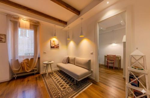 a living room with a couch and a table at Oltre il Borgo in Valentano