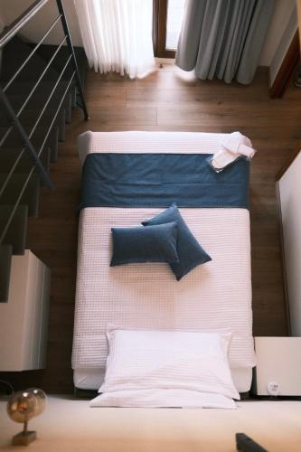 two beds with pillows on them in a room at Casa Delfina - Bergamo in Torre Boldone