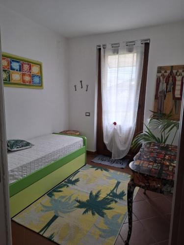 a small room with a bed and a window at Oasi della Calvana in Vaiano