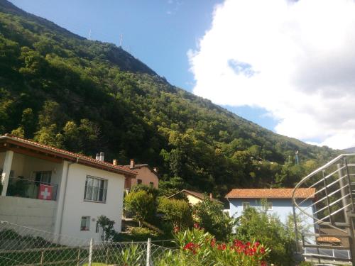 a mountain with a house in front of it at Casa Ines in Bellinzona