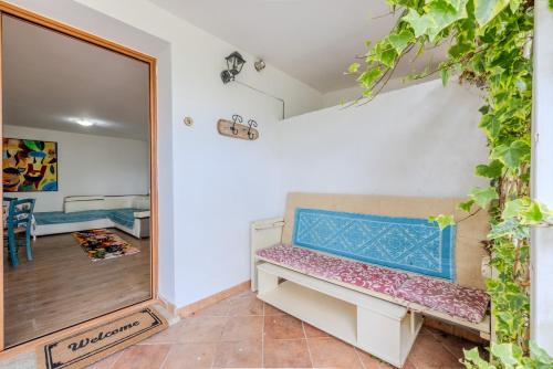 a dressing room with a bench and a mirror at Rai's Private Apt 3 - Panorama & Relax in Stazione Olbia