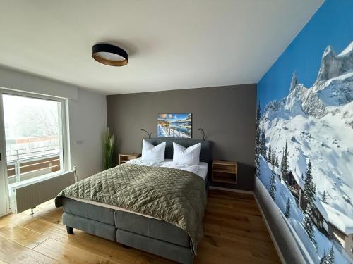 a bedroom with a bed with a snow covered wall at Mountain Lodge - Design Apartment in Winterberg