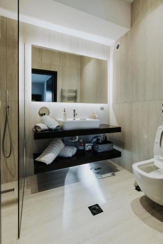 a bathroom with a sink and a toilet at Breathtaking view guesthouse2 in Psalidi
