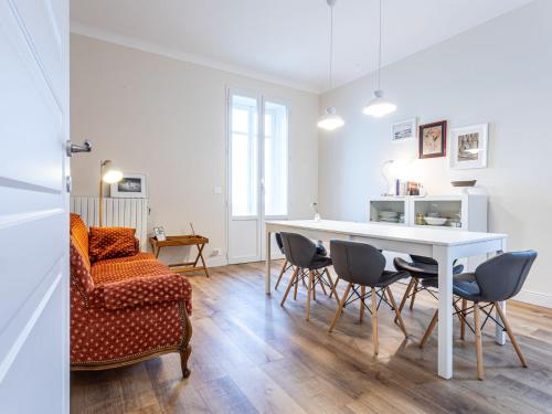a living room with a table and chairs and a couch at Apartment Bacolla by Interhome in Cocconato