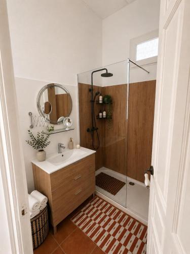 a bathroom with a shower with a sink and a mirror at Van Gogh Flat By La Gobernanta in Alicante