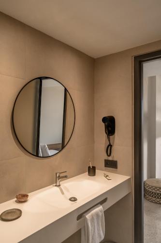 a bathroom with a sink and a mirror at Caramelo Calvia Beach - Adults Only in Magaluf