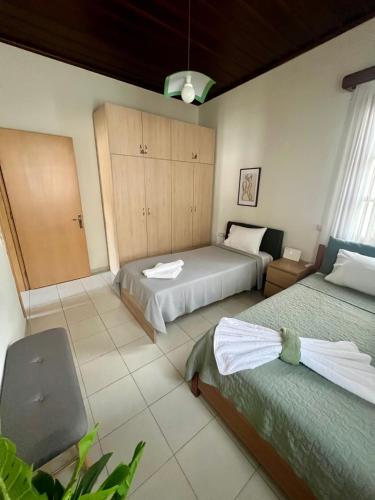 a hotel room with two beds and a room with at Lagom House in Panagia