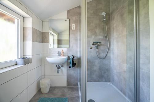 a bathroom with a shower and a sink at Häusle Felix in Weier