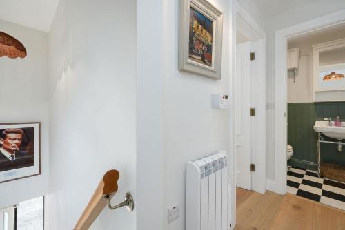 a bathroom with a white radiator and a sink at Cottage 298 - Clifden in Clifden