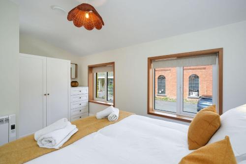 a bedroom with a large bed and a window at Cottage 298 - Clifden in Clifden