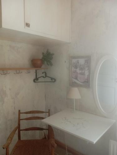 a dining room with a table and a chair at Guest Room in Liviöjärvi