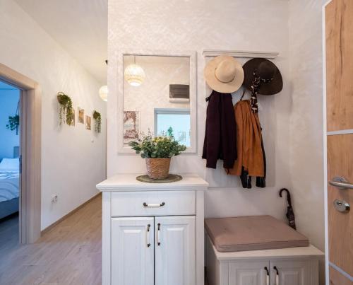 a bathroom with a white cabinet and a mirror at Villa Aurea Luxury Sunset with Pool in Krimovice