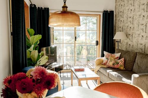 a living room with a couch and a table at Green Gables Bed and Breakfast in Cygnet