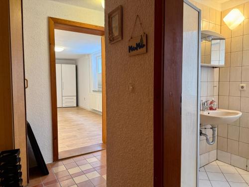 a bathroom with a sink and a mirror at Gästehaus in Bad Sülze