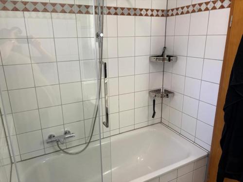a bathroom with a shower and a bath tub at NEU! Ferienappartement Nino in Rötz