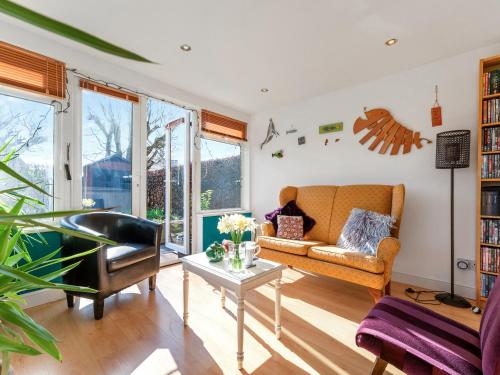 a living room with a couch and a table at Applepips in Stirling