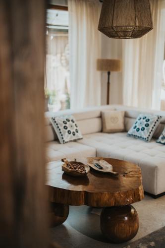 a living room with a couch and a coffee table at Gardiasówka na Roztoczu in Chlewiska