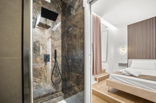 a bathroom with a shower and a bed in a room at Hidden Pyramid Suites in Rome