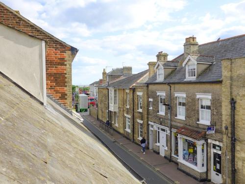 a group of buildings on a city street at The Photographer's House in Southwold