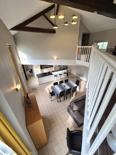 an overhead view of a living room and dining room at Spacious duplex house in Grosbreuil in Grosbreuil