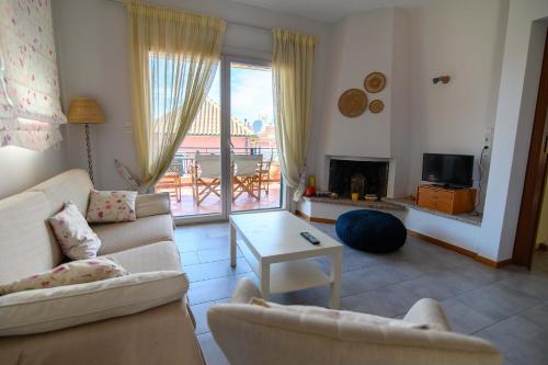 a living room with two couches and a table at Spacious 2 Bd Balcony Apt in Preveza in Preveza