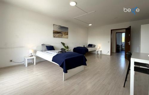 a bedroom with two beds and a fireplace at BEGE APARTMENTS HomeAway in Marl