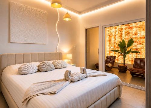 a bedroom with a bed with two pillows on it at Sanctuaire bien-être in Sélestat