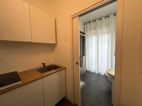 a small bathroom with a sink and a toilet at Residence Greta in Parma