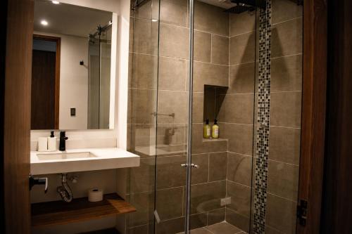 a bathroom with a shower and a sink at Casa Siete Hotel Boutique in Bogotá