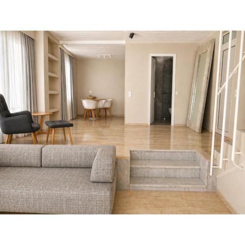 a living room with a couch and a table at Loriet Hotel in Mytilene