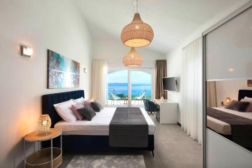a hotel room with a bed and a window at Luxury Panorama Vila with amazing Seaview in Gondolici 7 km from Rabac in Labin