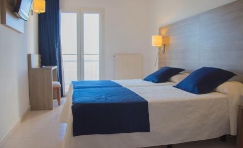 Letto o letti in una camera di Hotel Risech