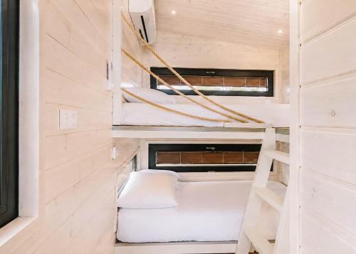 a tiny house with bunk beds in it at Tiny Seaside - Skarrev in Aabenraa