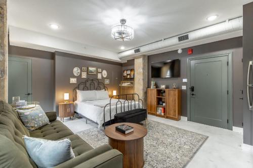 a living room with a bed and a couch at Park Hotel Studio Suite 311 in Chattanooga