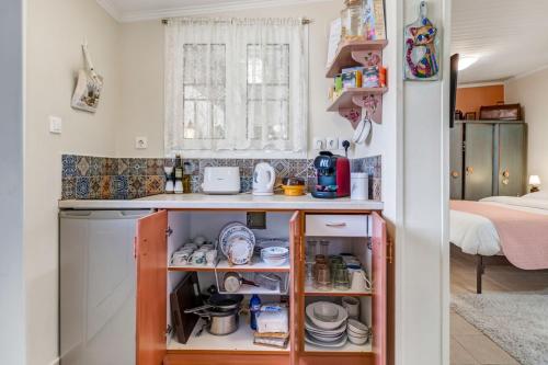 a small kitchen with a counter and a sink at Ancient Corinth Guest House in Korinthos