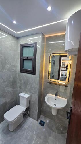 a bathroom with a toilet and a sink at 2bed rooms chalet portosaid in Port Said