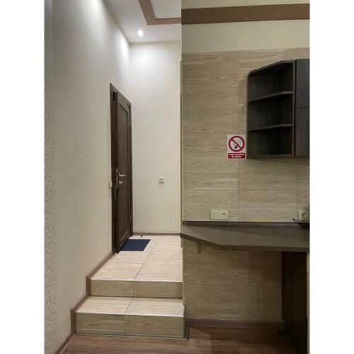 a hallway with stairs and a door in a building at Sumska 45 in Kharkiv