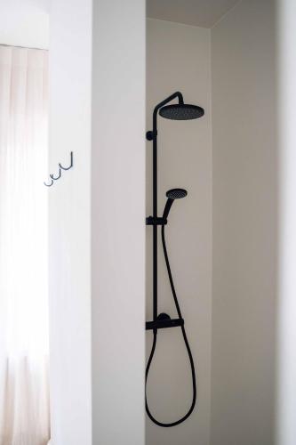 a black towel rack next to a window at Vakantiewoning number 44 in Ieper