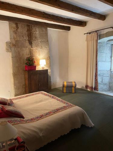 a bedroom with a large bed in a room at Château de Savigny - Suite Terre in Savigny