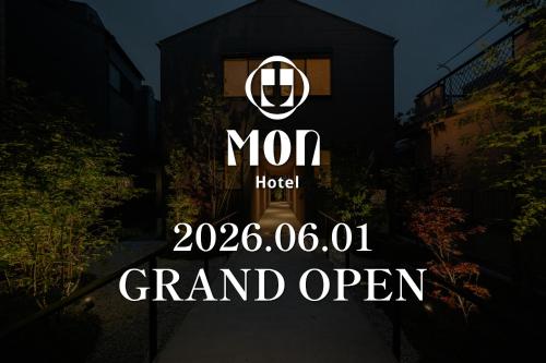 a sign for a hotel in front of a building at Mon Hotel HAKATA in Fukuoka