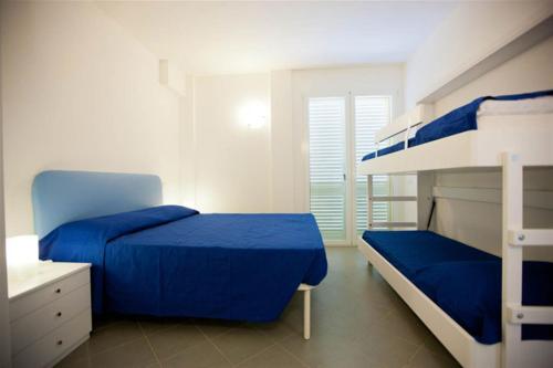 Poschodová posteľ alebo postele v izbe v ubytovaní Camping Blu Fantasy