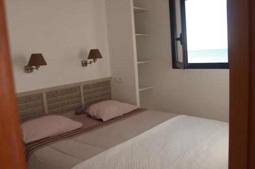 Ένα ή περισσότερα κρεβάτια σε δωμάτιο στο Les Pieds dans l'Eau