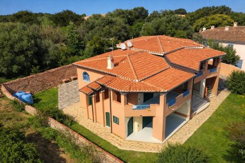 an overhead view of a house with an orange roof at Hotiday Apartments Orosei in Cala Liberotto