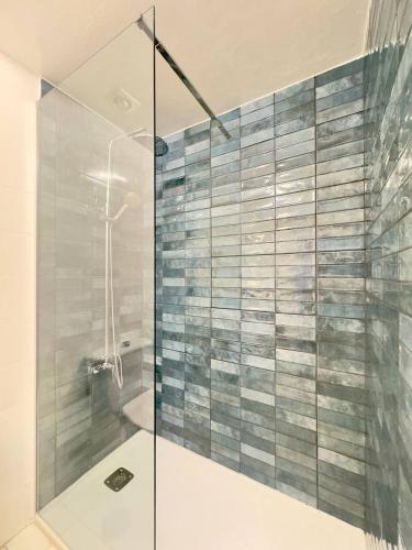 a shower with a glass door in a bathroom at Casa La Sofy in Costa de Antigua