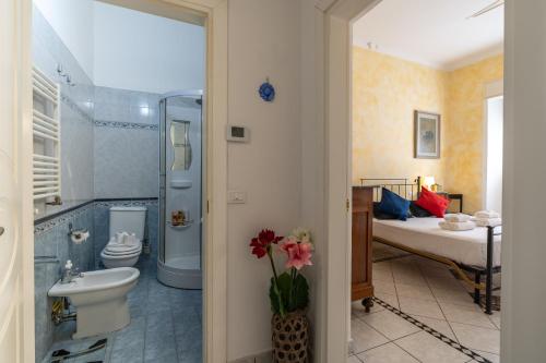 a bathroom with a shower and a toilet and a sink at Green Square Apartment 14 Min from Santa Croce with Hydromassage Tub in Florence