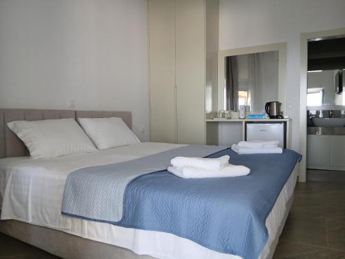 a bedroom with a bed with towels on it at Joanna hause in Gjilek