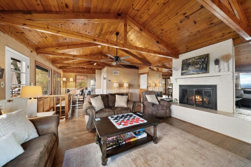 a living room with a couch and a table at Blowing Rock Skies in Lenoir