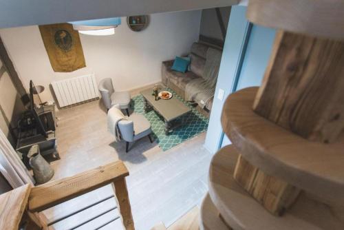 an overhead view of a living room with a couch at Le Cottage Bleu- In the Heart of Riquewihr by La Maison Bleue in Riquewihr