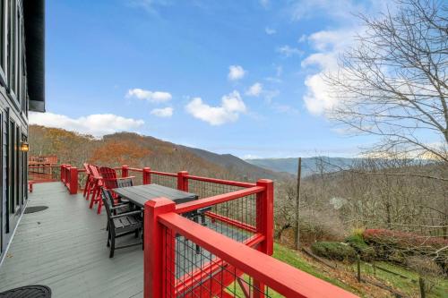a wooden deck with a table and chairs on it at Ace of Diamonds in Seven Devils